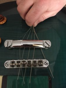 remove ball end of guitar strings 