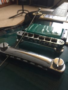 insert guitar strings through tailpiece